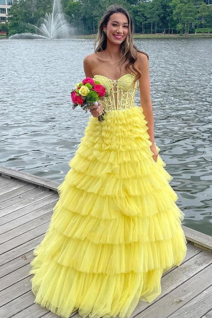Stepping into Elegance with the Strapless A Line Yellow Ruffle Tiered Tulle Long Prom Dress with Appliques